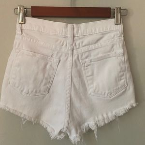 Distressed white denim shorts